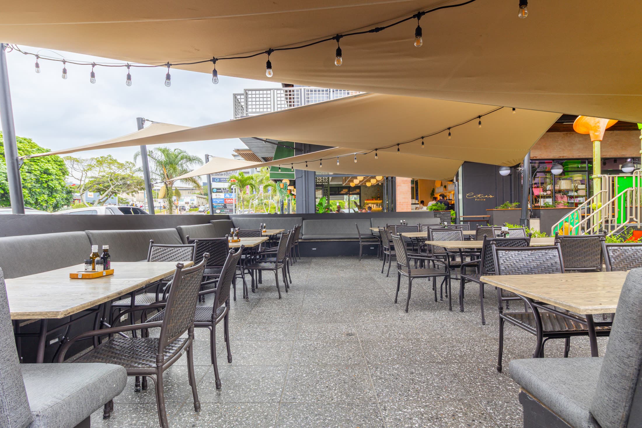 Outside patio seating area with pergola