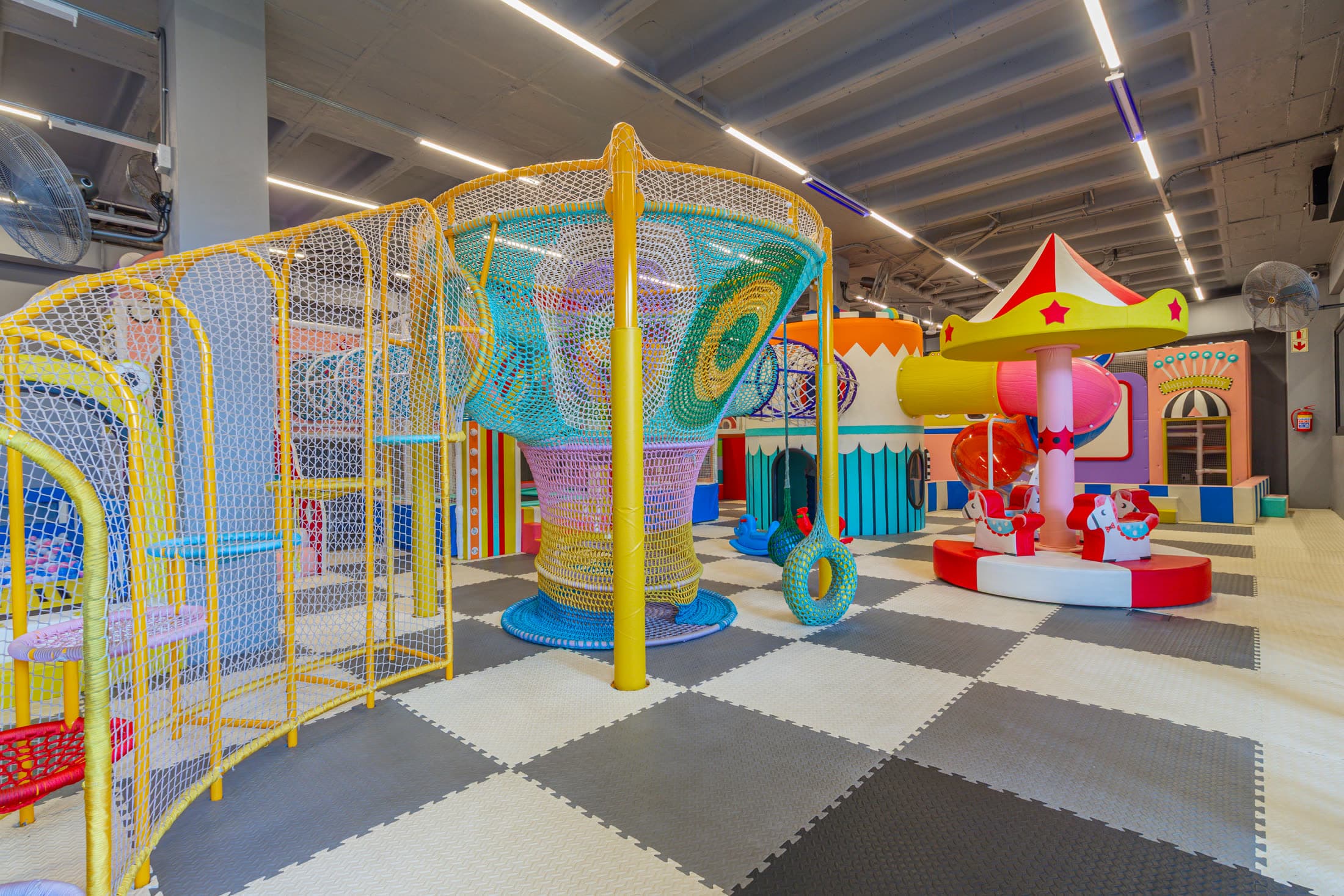 Bambini Land indoor play area with climbing structures and carousel